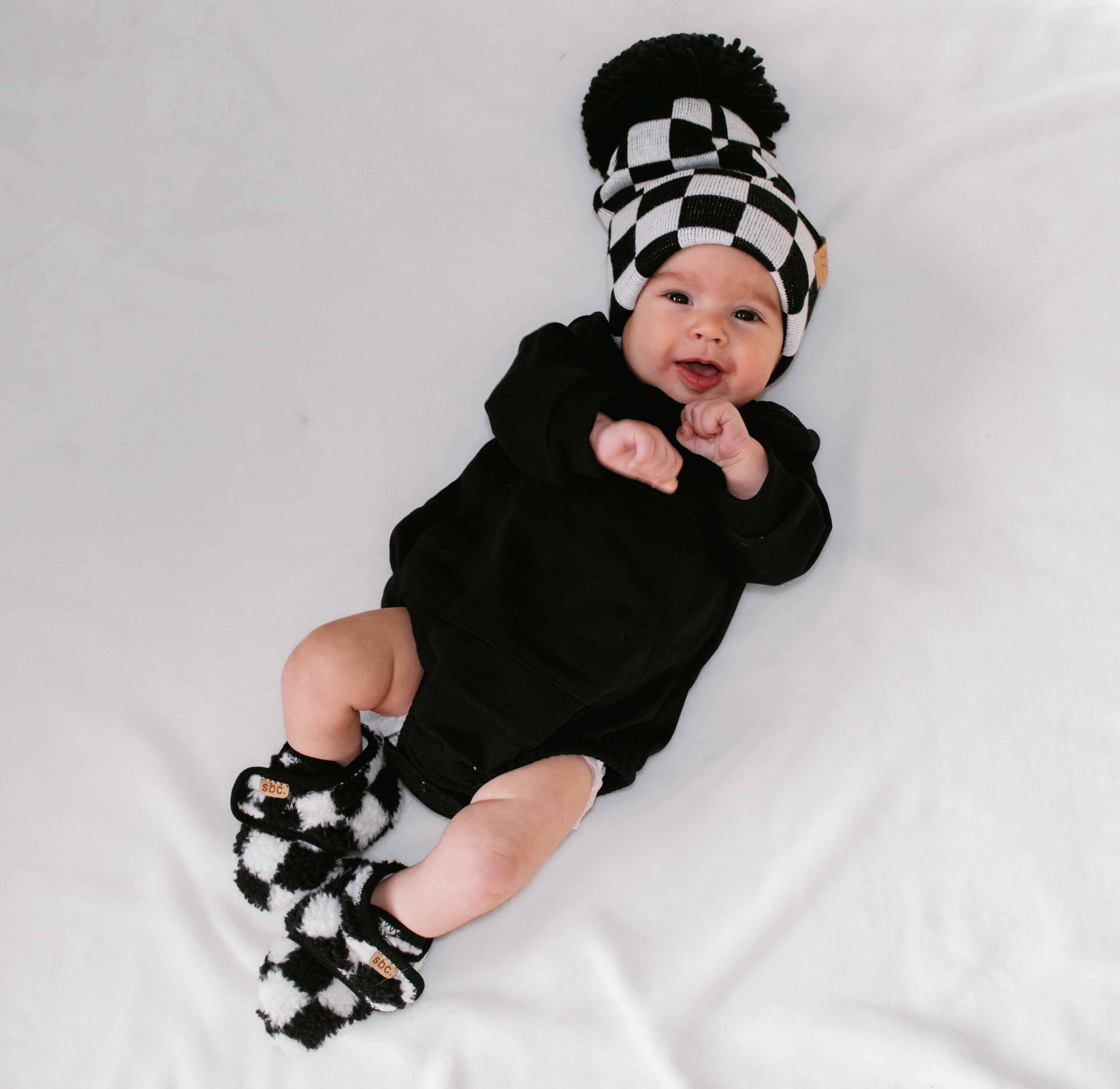 The Newborn Sherpa Bootie — Black + White Checkered - Rebel Bro