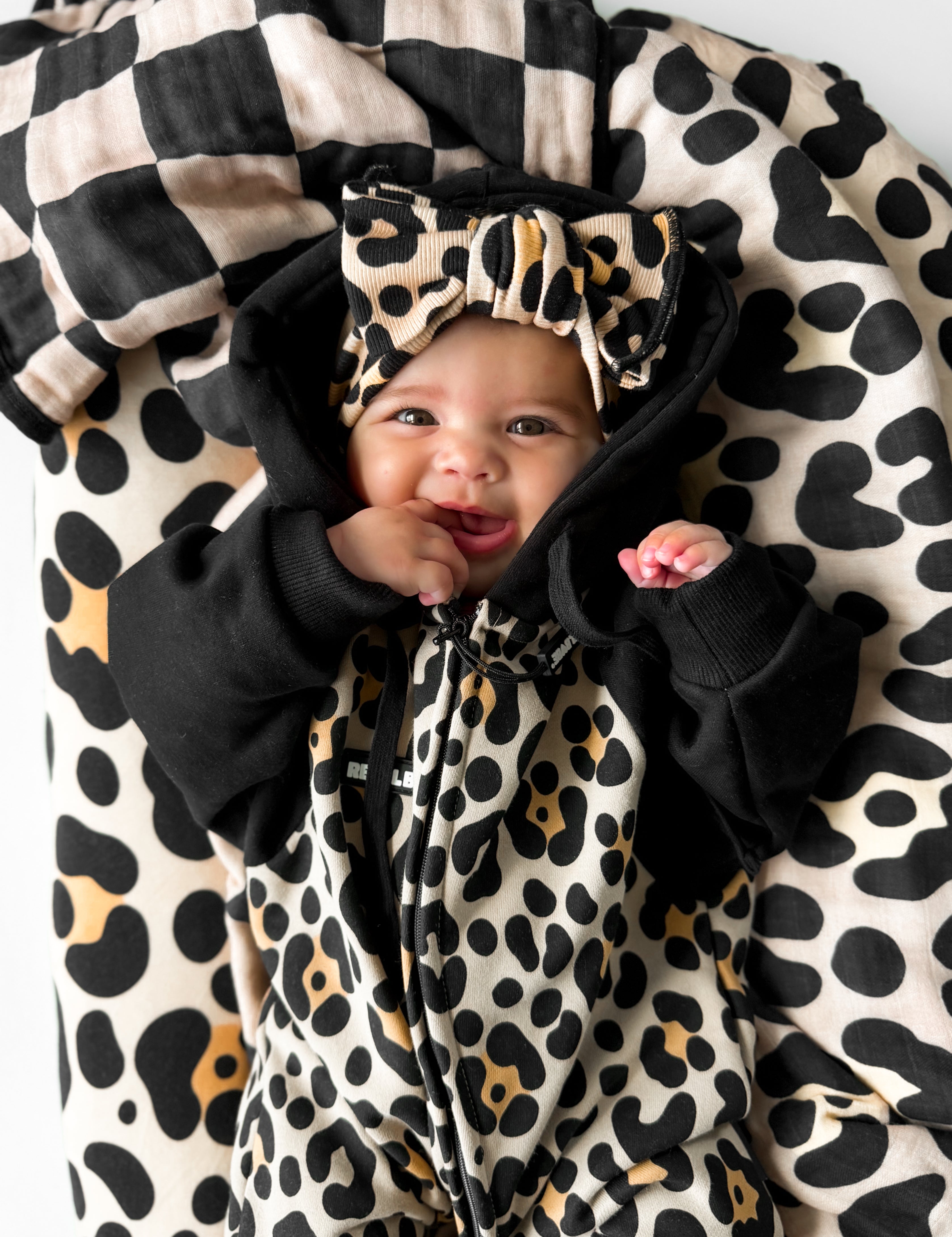 Reversible organic muslin quilt for babies and kids in Ava (Leopard) x Black + Taupe Checkered by Rebel Babe, photo 2 of 5