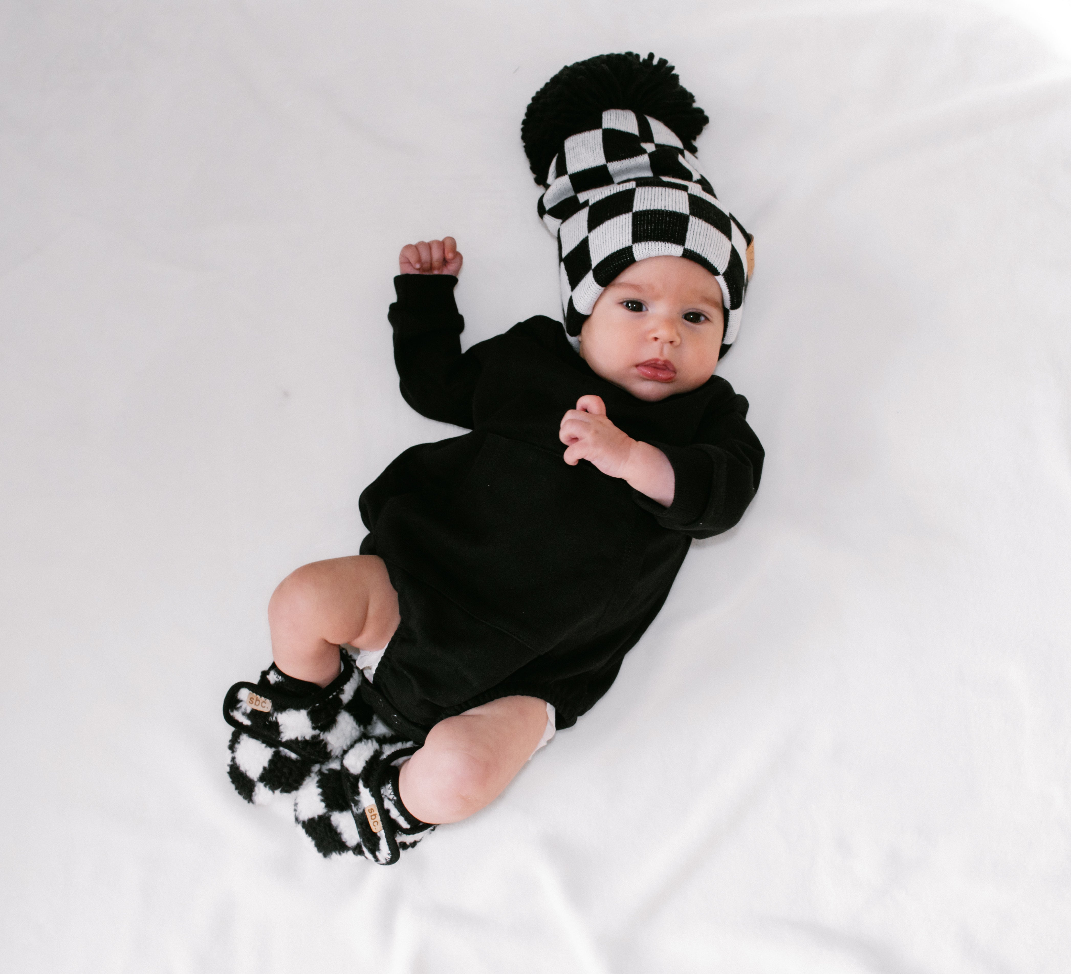 The Newborn Sherpa Bootie — Black + White Checkered - Rebel Bro
