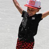 Hybrid Swim Trunks in Americana Red + Black Checkered