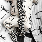 Ruffled Bamboo Zippy Sleeper in Lana (Bows)