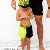 Hybrid Swim Trunks in Neon Electric Lime + Black Colorblock