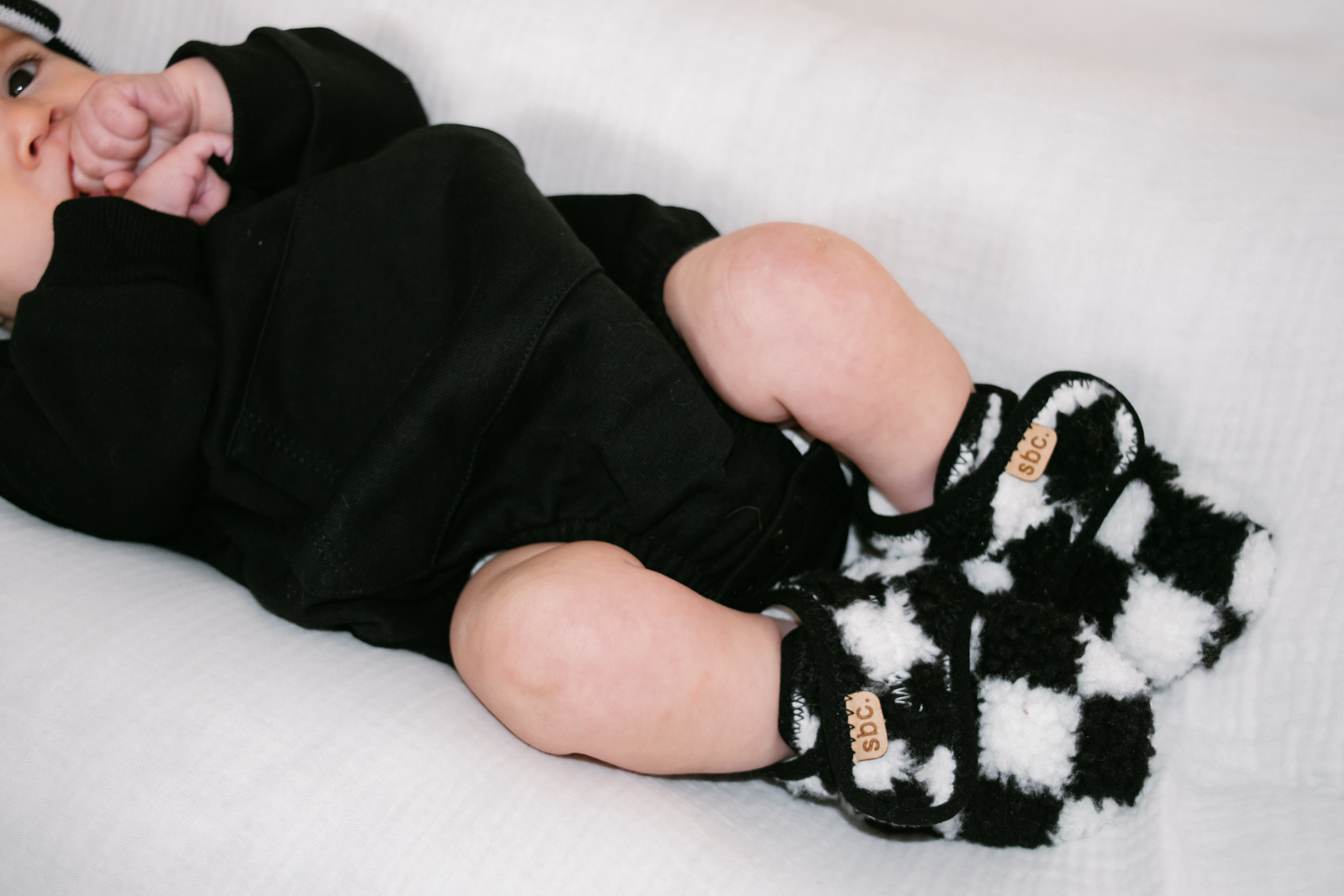 The Newborn Sherpa Bootie — Black + White Checkered - Rebel Bro