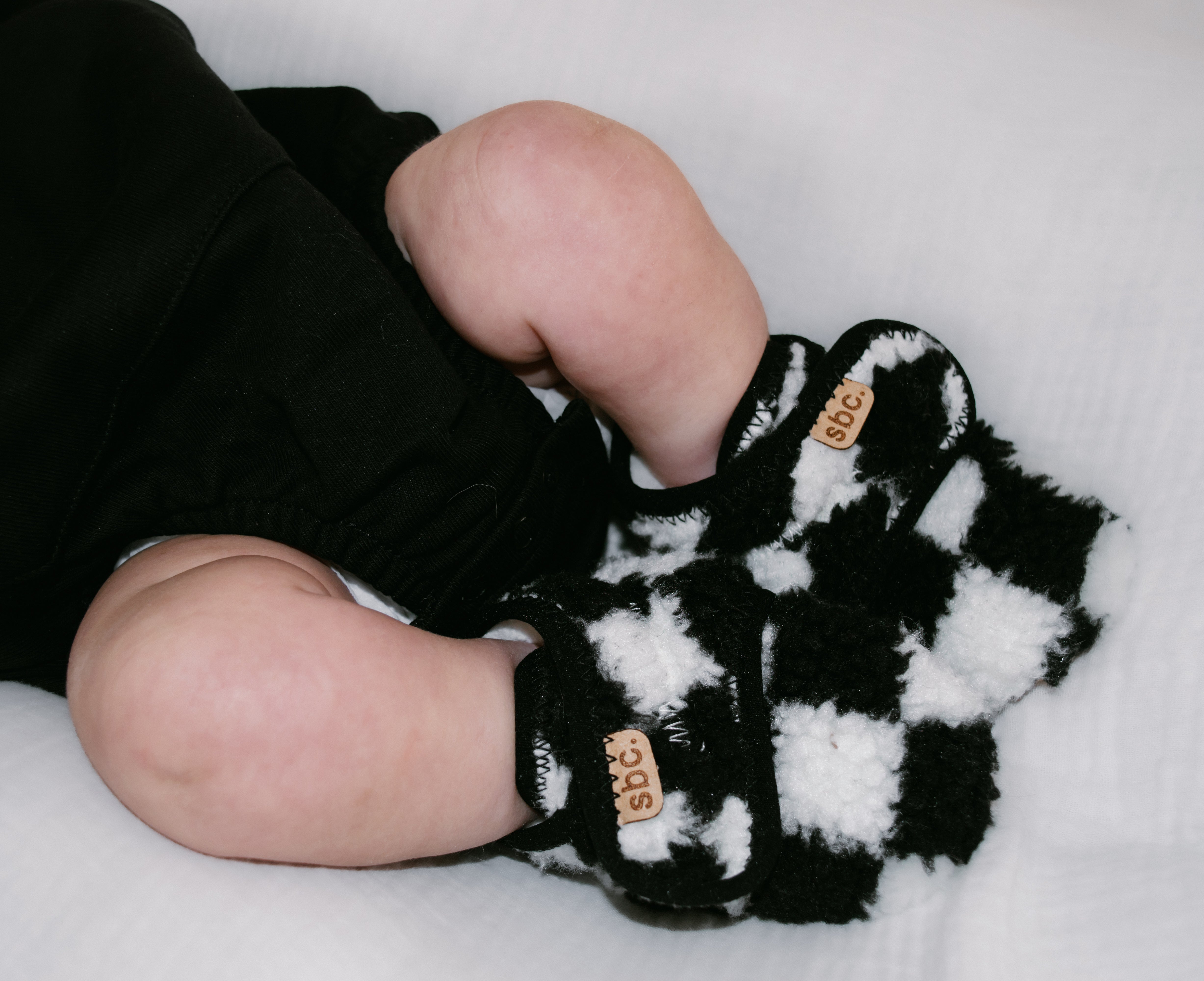 The Newborn Sherpa Bootie — Black + White Checkered - Rebel Bro