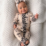 Ruffled Bamboo Zippy Sleeper in Lana (Bows)
